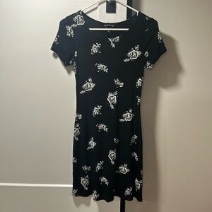 Black dress with white flowers. Size small no tags cut out due to be itchy